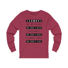 WE BUY THE THINGS WE DON'T NEED...Unisex Jersey Long Sleeve Tee